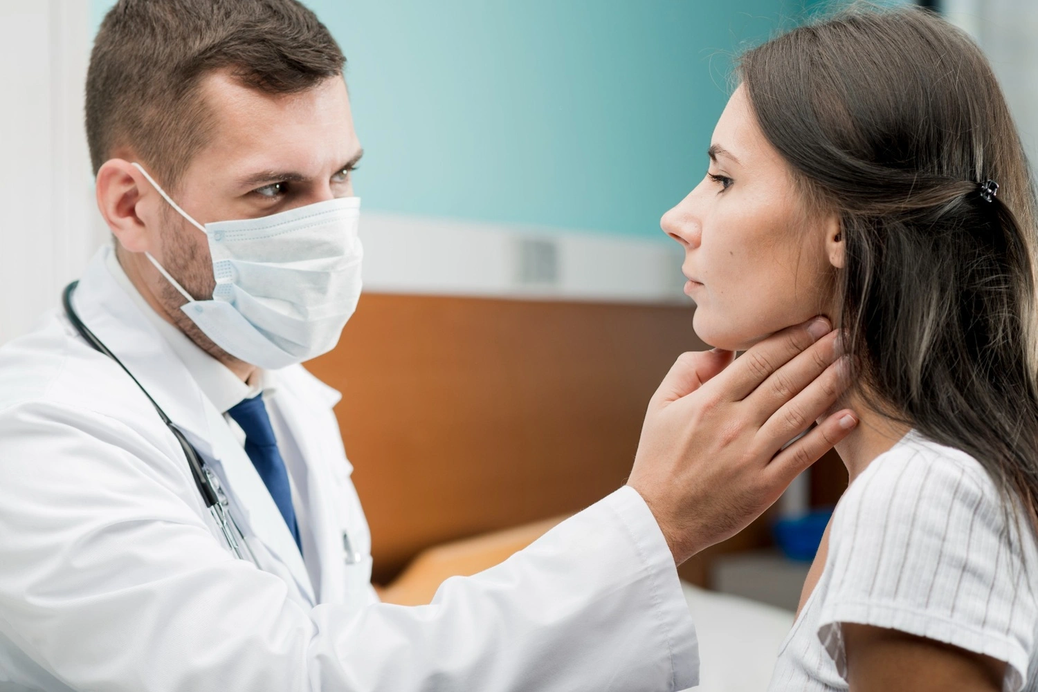 The best ENT doctor examining a patient’s throat during consultation at a clinic in Navalur