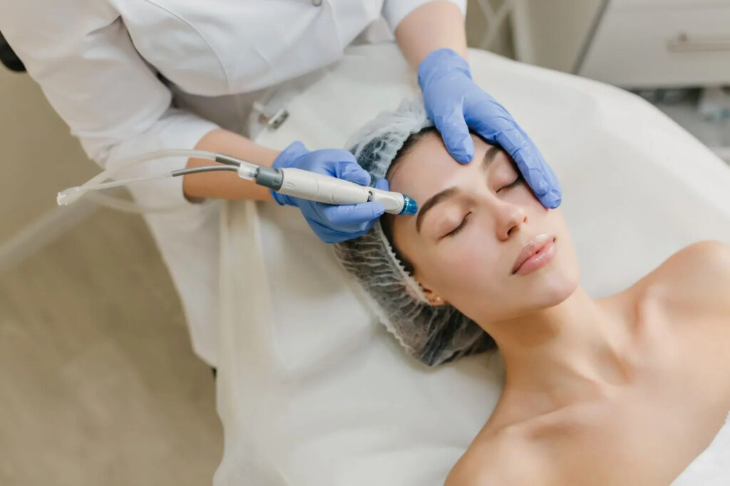 Dermatologist performing facial skincare treatment for open pores and glowing skin